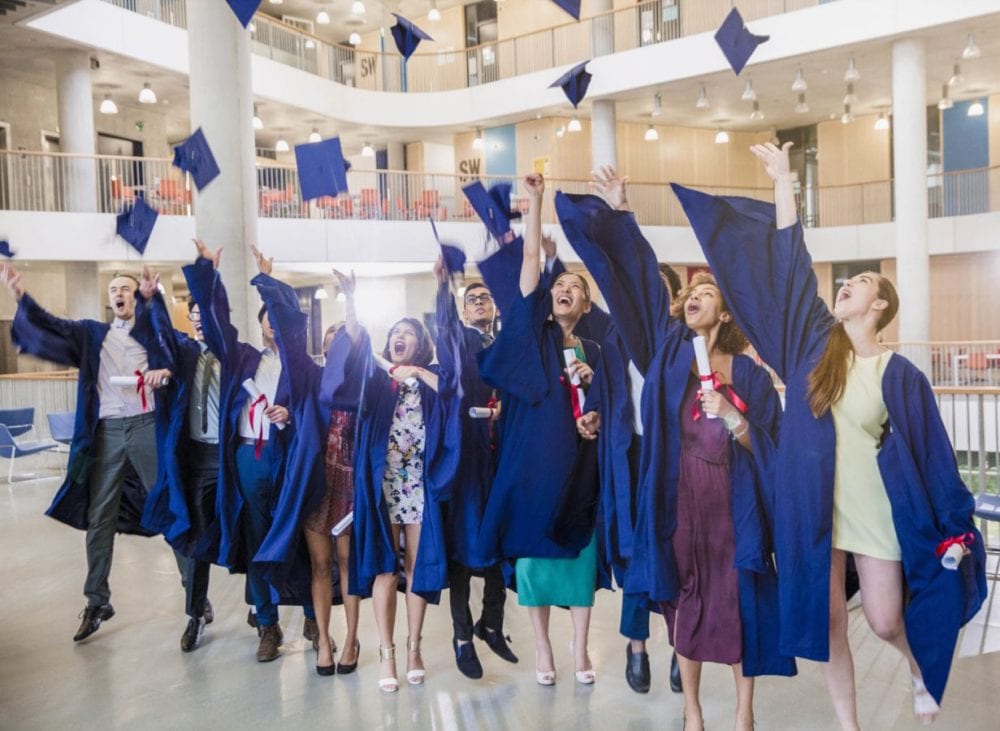 MC-graduates_group_indoor