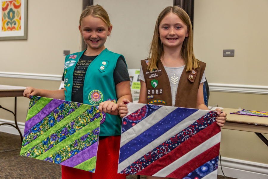 Girl Scout teaches sewing and helps charity